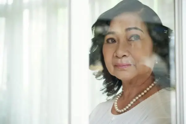 10 Common Mistakes To Avoid When Writing Your Will 8 a woman looking out the window