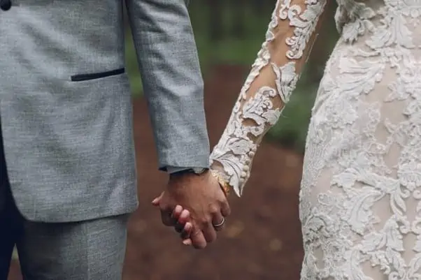 10 Common Mistakes To Avoid When Writing Your Will 9 newlywed holding hands