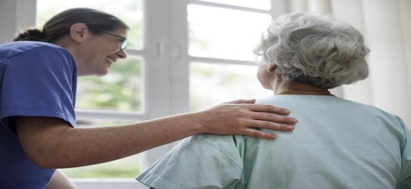 caretaker looking after an elderly